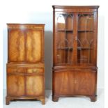 A 20TH CENTURY ANTIQUE STYLE FLAME MAHOGANY COCKTAIL CABINET AND INVERTED BOW FRONT CORNER CABINET