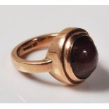 9CT GOLD AND STAR RUBY CABOCHON RING