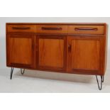 A RETRO 1970’S TEAK WOOD G-PLAN SIDEBOARD RAISED ON HAIRPIN LEGS