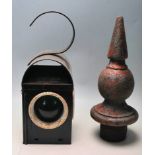 A VINTAGE MID CENTURY RAILWAY LAMP / SAFETY LAMP AND A CAST IRON SPIKE