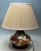MOORCROFT TABLE LAMP OF BALUSTER FORM WITH ANNA LILY BASE PATTERN