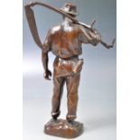 HANS MüLLER AUSTRIAN BRONZE OF A FARMER WITH SCYTHE