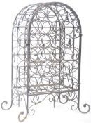 19TH CENTURY WROUGHT IRON WINE RACK OF ARCHED FORM