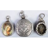 COLLECTION OF ANTIQUE RELIGIOUS SILVER LOCKETS AND PENDANTS