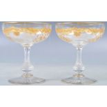 PAR OF BACARAT MANNER GILDED CHAMPAGNE GLASSES