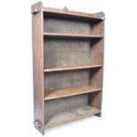 ARTS AND CRAFTS UPRIGHT OAK BOOKCASE IN THE MANNER OF LIBERTIES