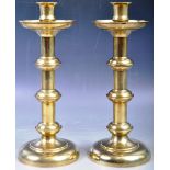 PAIR OF 19TH CENTURY BRASS GOTHIC INFLUENCE CANDLESTICKS