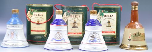 A GOOD GROUP OF SEVEN BELL'S OLD SCOTCH WHISKY AND DECANTERS