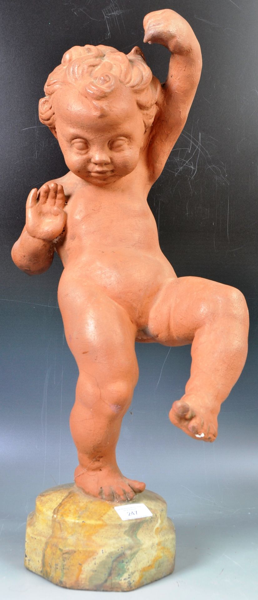 DECORATIVE ANTIQUE STYLE FIGURINE OF A DANCING CHERUB