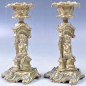 PAIR OF 9TH CENTURY ROCOCO INFLUENCE CHERUB CANDLESTICKS