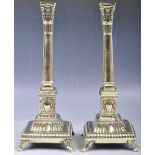 PAIR OF GEORGIAN REGENCY PERIOD CLASSICAL BRASS CANDLESTICKS