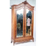 EARLY 20TH CENTURY DOUBLE DOOR FRENCH ARMOIRE OF WALNUT CONSTRUCTION