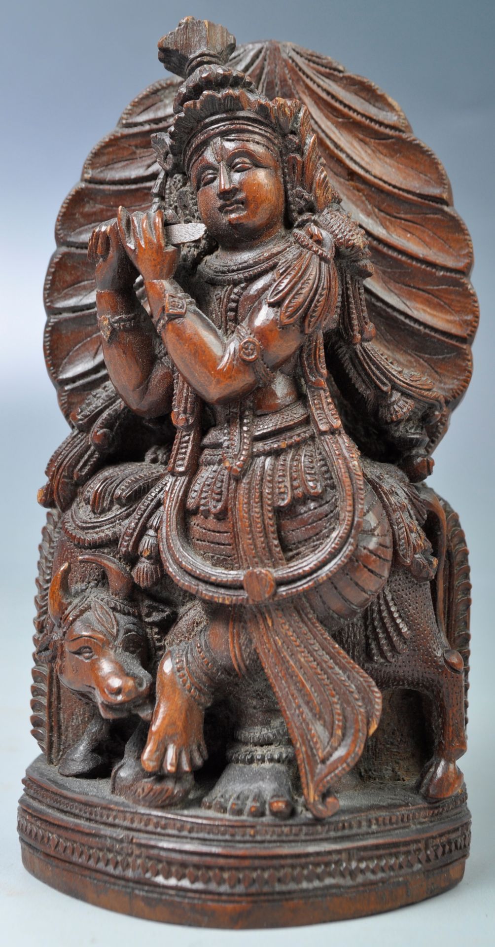 19TH CENTURY CARVED INDIAN FIGURINE OF KRISHNA AN COW