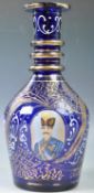 19TH CENTURY BOHEMIAN BLUE GLASS GILDED BOTTLE