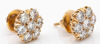 A pair of hallmarked 15ct gold and diamond cluster earrings