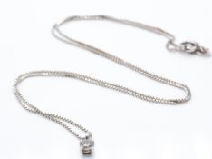 A hallmarked 14ct white gold and diamond pendant necklace