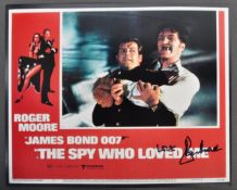 ROGER MOORE - JAMES BOND 007 - SIGNED LOBBY CARD -