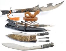 COLLECTION OF KUKRI KNIVES WITH AN AFRICAN SWORD