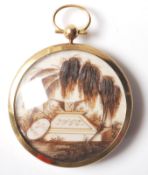 A GEORGIAN GOLD AND HAIR MOURNING LOCKET DATED 182