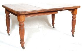 ANTIQUE MAHOGANY EXTENDABLE DINING TABLE
