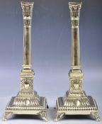 PAIR OF GEORGIAN REGENCY PERIOD CLASSICAL BRASS CANDLESTICKS