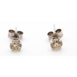 A Pair of 14ct White Gold Single Stone Diamond Stud Earrings