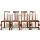 A SET OF FOUR MID CENTURY 1930’S STYLE OAK DINING CHAIRS WITH LEATHER SEATS