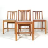 A SET OF FOUR OAK CHAPEL CHURCH CHAIRS WITH PADDED SEATS