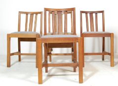 A SET OF FOUR OAK CHAPEL CHURCH CHAIRS WITH PADDED SEATS