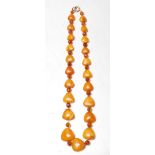 EARLY 20TH CENTURY HEART SHAPED AMBER NECKLACE STRING