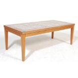 A VINTAGE RETRO 20TH CENTURY DANISH INSPIRED TEAK WOOD COFFEE TABLE WITH TILE TOP