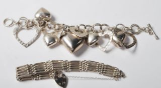 1980’S SILVER BRACELET WITH OVAL LINKS AND HEART SHAPED PADLOCK