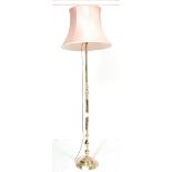 A 20TH CENTURY ANTIQUE STYLE BRASS FLOOR STANDING LAMP