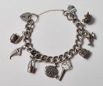 VINTAGE STERLING SILVER CHARM BRACELET