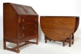 AN ANTIQUE STYLE JAYCEE JOCOBEAN REVIVAL LATE 20TH CENTURY OAK FALL FRONT BUREAU.