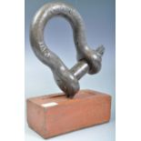 RETRO VINTAGE SHACKLE DOORSTOP ON A BRISTOL BRICK