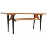 MID CENTURY ENGLISH TEAK WOOD COFFEE TABLE RAISED ON EBONISED SUPPORTS