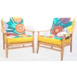 MATCHING PAIR OF RTERO OAK FRAMED LOUNGE ARMCHAIRS IN THE MANNER OF HANS WEGNER