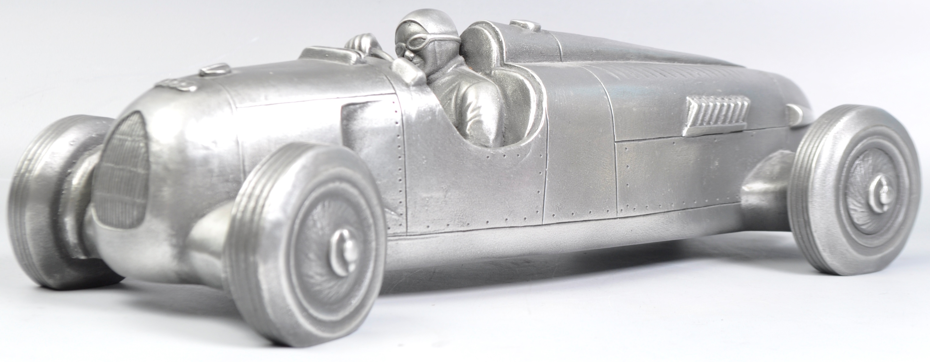 COMPULSION GALLERY PEWTER MODEL OF AN AUDIO RACE CAR