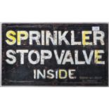 SPRINKLER STOP VALVE INSIDE HEAVY CAST IRON SIGN.