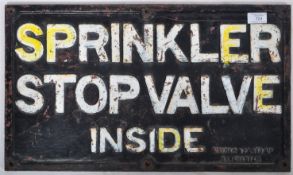 SPRINKLER STOP VALVE INSIDE HEAVY CAST IRON SIGN.