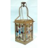 An early-20th century brass and leaded light gas lantern, with four multi-coloured glass panels