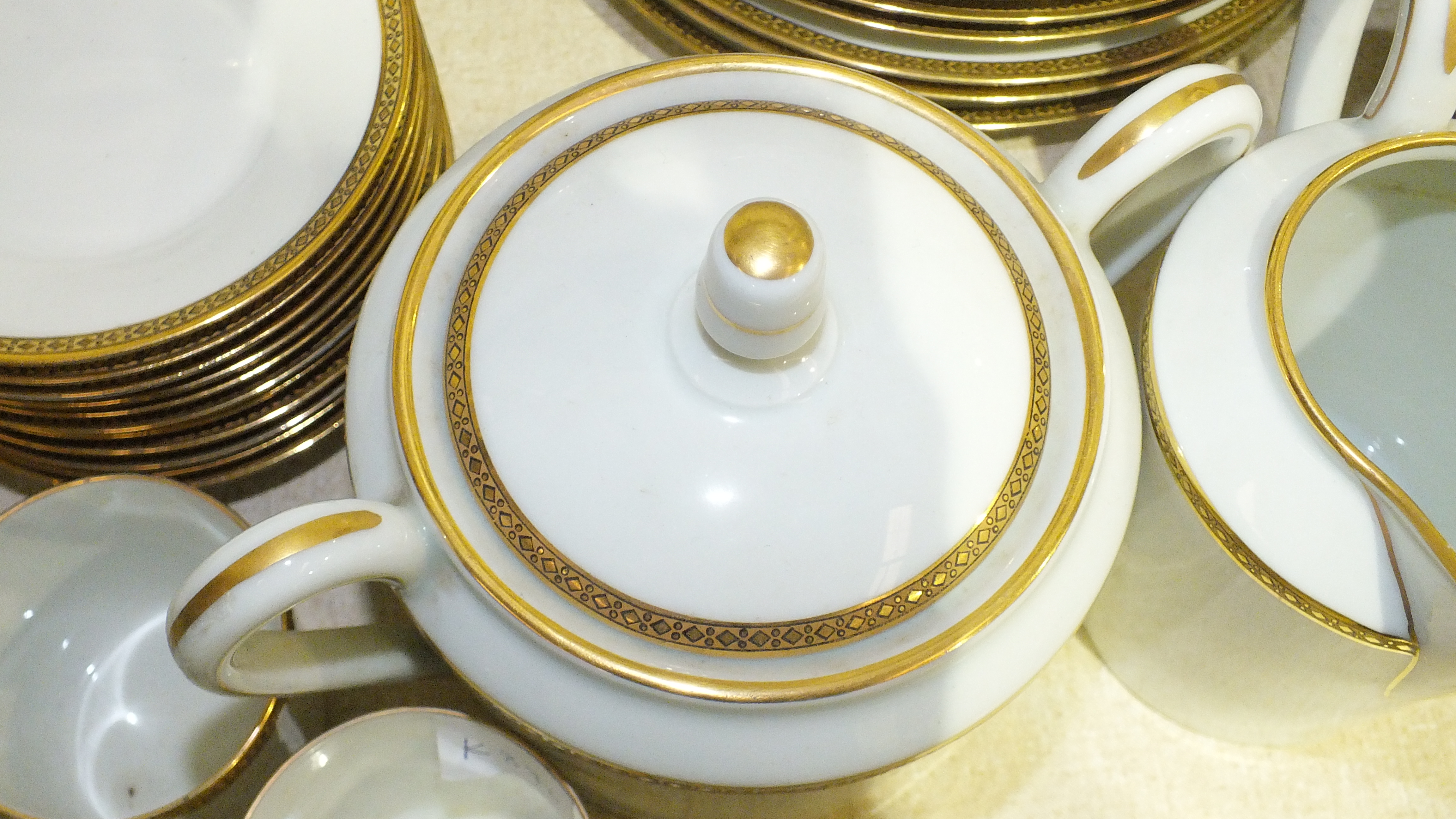 Eighty-seven pieces of Limoges dinner and coffee ware, of plain white ground with gilt-decorated - Image 3 of 6