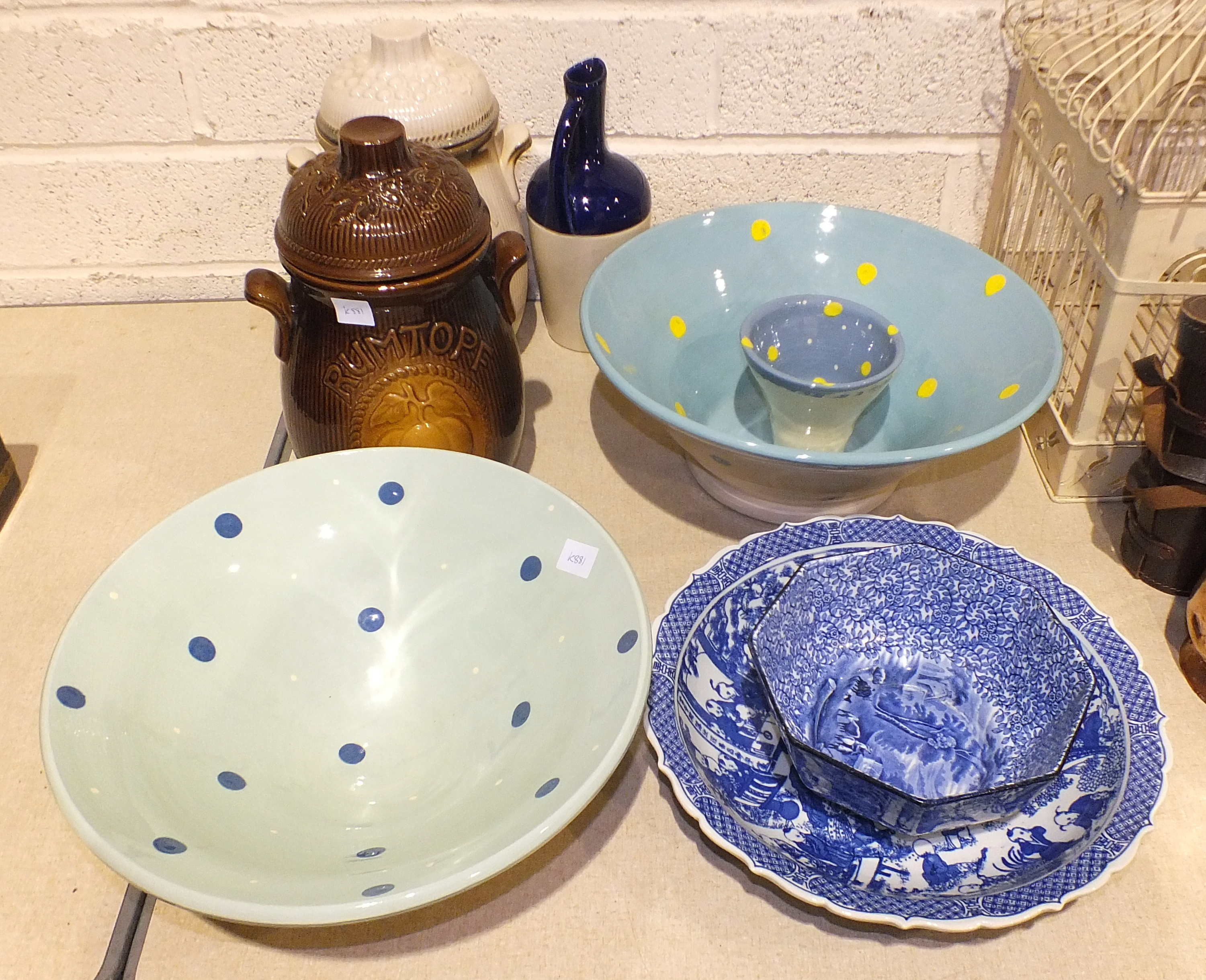 A large studio pottery bowl, the interior with a blue ground and yellow dots, the outer cream with