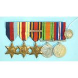 A group of five WWII medals: 1939-45, Africa and Burma Stars, War and Defence Medals, along with