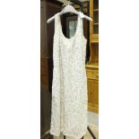 A knitted wool and beaded dress by Tricoville, British Hong Kong, size 18.