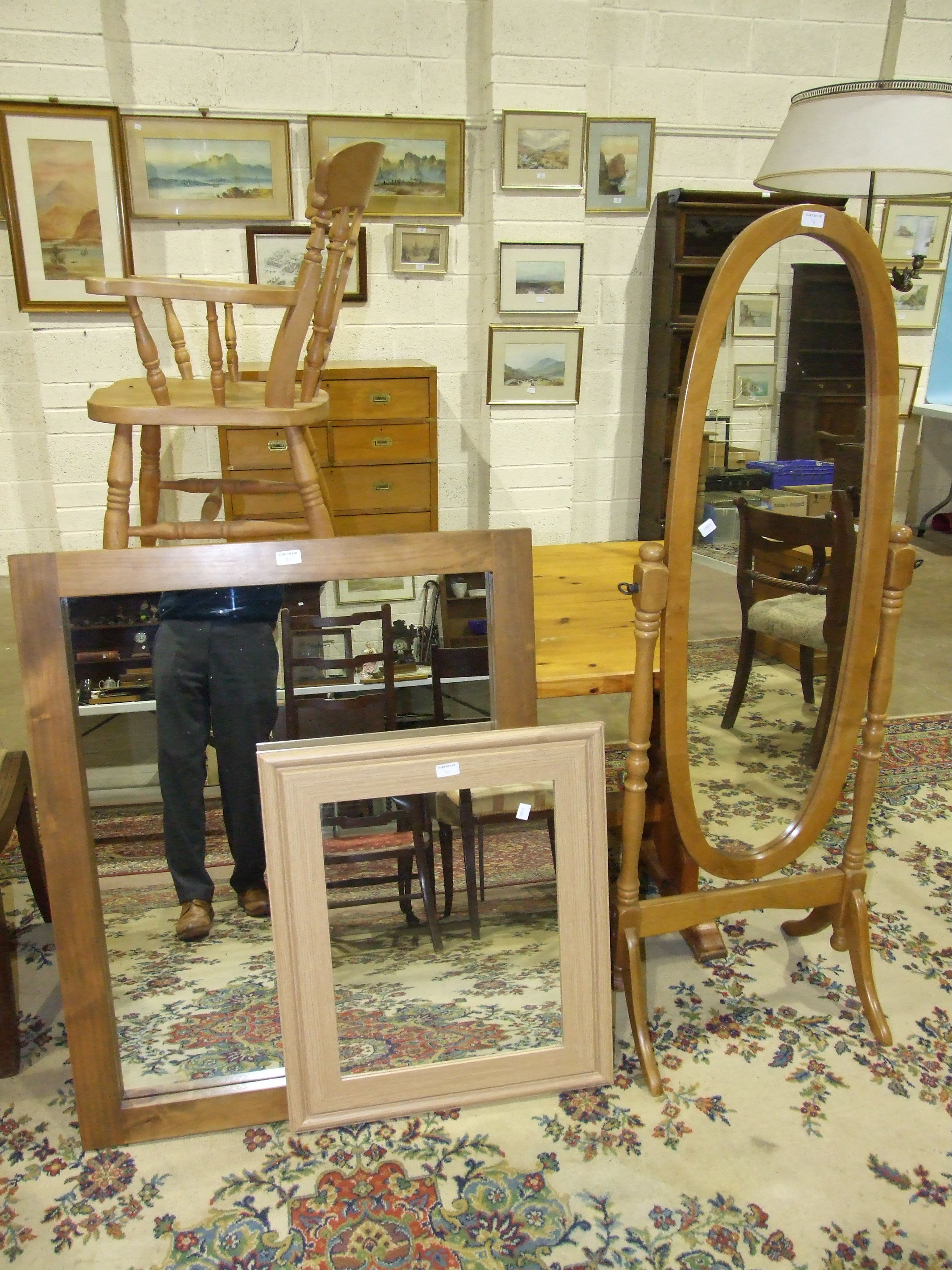 A modern pine armchair, a modern oval cheval mirror, a modern yellow pine refectory table and two