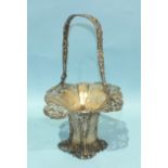 An Edwardian silver Art Nouveau-style basket with pierced loop handle decorated with flowers and