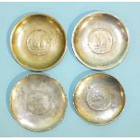 Two Chinese white metal circular pin trays with Chinese junk silver dollar inset, one marked "