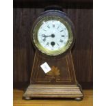 An Edwardian inlaid mahogany mantel clock, having a rounded top and tapering body, 27cm high.